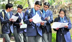 Students come out of the examination halls on the first day of the Board examinations in Dehradun on Wednesday
