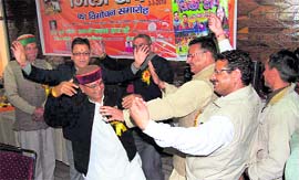 Disaster and Social Welfare Minister Khajan Das dances at the release of Zila Top in Mussoorie on Wednesday