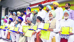Sarpanches of five village panchayats after they were honoured in Ludhiana