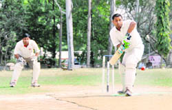 A batsman plays a defensive shot in the Jitender Singh Anand (Kaka) Cricket Tournament in Dehradun 