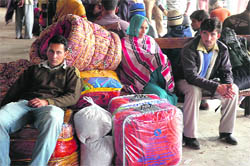 Srinagar-bound passengers, who were stranded at the Jammu bus stand on Thursday following a heavy snowfall in the valley