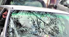 A cars windshield reflects branches of a tree after the rain in Ludhiana on Thursday.