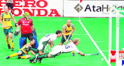Australian and South African players fight for the ball