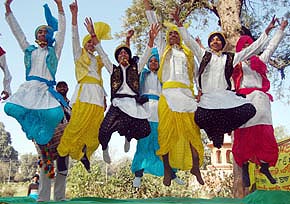 Students perform bhangra during Amritsar Heritage Festival on Friday.