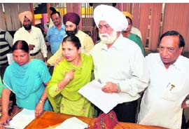 Councillors of opposition party protest at a municipal council meeting at Mohali on Friday