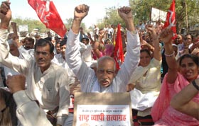 Activists of a traders union hold a demonstration demanding improvement in labour laws in Gurgaon on Friday.
