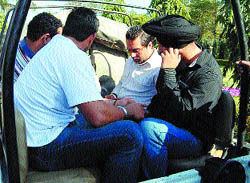 The accused kidnappers being taken to the police station in Amritsar
