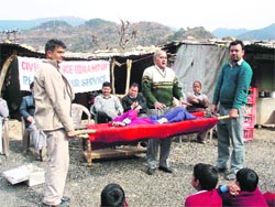 A Civil Defence functionary imparts rescue training to people residing near NH1 at Thard village.