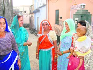 Sarpanch Maya (second from left) of Teent village with local women