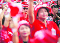 Supporters of former Thailand PM Thaksin Shinawatra hold a gathering in a town near Bangkok on Friday. Thaksins supporters want the government to dissolve Parliament.