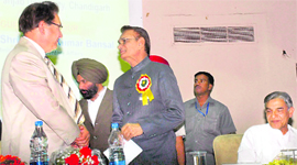 Punjab Governor and UT Administrator Shiv Raj Patil has a word with PU VC Prof RC Sobti as Union Minister of Finance Pawan Kumar Bansal looks on at a conference in Panjab University, Chandigarh, on Saturday.