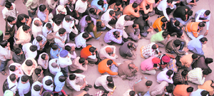 People wait for their turn during the 'Samadhan 2010' lok adalat at district courts in Chandigarh on Saturday.