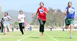 Girls compete in the athletics championship of the Uttarakhand Technical University at Maharana Pratap Sports Stadium in Dehradun on Saturday