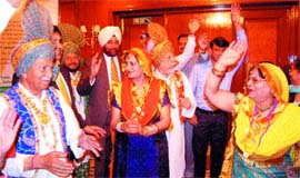 Jalandhar DC A.S. Pannu, along with patients, performs bhangra in Jalandhar on Saturday.