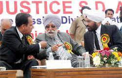 Justice Mehtab Singh Gill (centre) of the Punjab & Haryana High Court sharing a point with Justice SD Anand and District and Sessions judge Kuldip Singh during the inaugural function of the newly constructed judicial complex in Bathinda