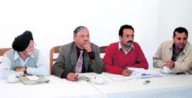 Members of the Mussoorie Hotel Association hold a press conference in Mussoorie on Sunday.