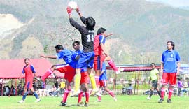 A match in progress at the Uttarakhand Technical University Football Tournament in Dehradun on Sunday.
