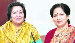Rakesh Dhawan, a social worker, and Dr Indu Singh, Principal, MKP College, at a felicitation ceremony in Dehradun on Sunday.