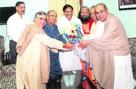 Hinduja brothers meet Uttarakhand Chief Minister Ramesh Pokhriyal Nishank in Dehradun on Sunday.