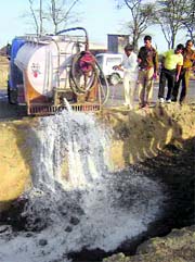 Spurious milk seized from Khasapathana village in Fatehabad being dumped in the open.