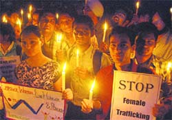 Students take out a candle march on International Womens Day at Panjab University on Monday. 