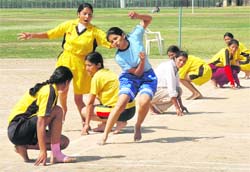 Players in action during the PU Inter-College Womens Kho-Kho Championship at the university grounds in Chandigarh on Monday.
