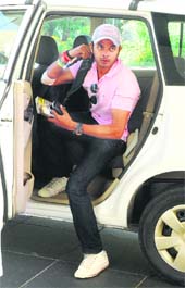 Kings XI cricketer S Sreesanth comes out of a car after his arrival at a hotel in Chandigarh on Monday.