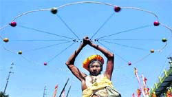 A saint demonstrates skill during the second phase of the Peshwayi in Haridwar on Monday