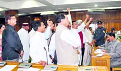 Congress legislators raise slogans in the well of the House disrupting Governors address