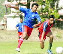 Players in action at the Uttarakhand Technical University Football Tournament in Dehradun on Monday