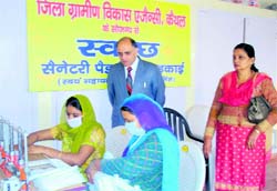 Rural women manufacture sanitary napkins during a DRDA-sponsored workshop at Panchayat Bhawan in Kaithal