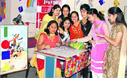Women staff and students of The Legends English Village participate in a function during Womens Day celebration 