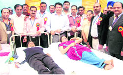 Dr Kamal Preet Singh Dhillon, Ambikapur Deputy Commissioner, with donors at Ahmedgarh