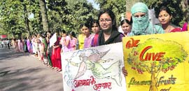 College students form a human chain on Womens Day in Patna on Monday.
