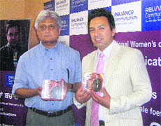 Manmohan Waris with Arvind Kumar of Reliance Communications
