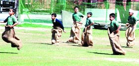 Students of Spring Dale Senior Secondary public School participate in sack race in Amritsar.