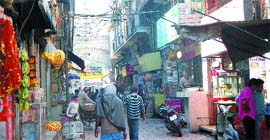 The shops, which are to be demolished for the beautification of Durgiana Temple, still stand tall.