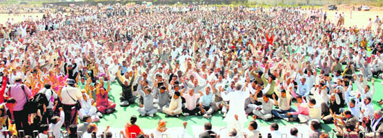 Members of the Haryana Karamchari Maha Sangh protest against the state government for the non-implementation of the Sixth Pay Commission at the rally ground in Sector 25, Chandigarh