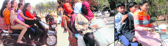 Women violate traffic rules on city roads with impunity.