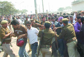 Policemen try to control the crowd at the audition of Sony TV's Indian Idol show in Noida on Tuesday.