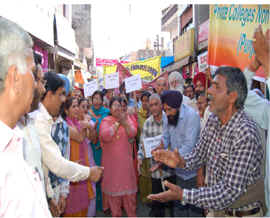 Non-teaching employees of aided colleges protest in Nawanshahr on Tuesday.