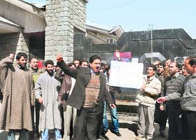 State government employees shout slogans on the first day of their five-day strike in Srinagar