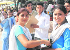 Students of Class XII at an examination centre in Panchkula after they were told that the exam had been cancelled following paper leak, on Wednesday.