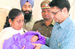 The baby girl being handed over to the representative of an NGO in Ludhiana