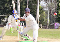 A batsman plays a shot during a match of the Jitendra Anand Memorial Cricket Tournament in Dehradun