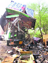 The wreckage of a truck which rammed into an oil tanker on the Rohtak-Jhajjar highway near Kanheli village 