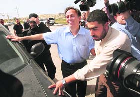 British journalist Paul Martin (C) gestures after he was released in Gaza on Thursday by the Hamas Islamist rulers of Gaza Strip, nearly four weeks after his arrest on suspicion of spying for Israel. 