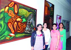 Budding artists of BBK DAV College for Girls display their creations during an exhibition at an art gallery in Amritsar. 