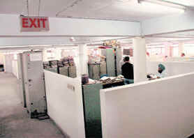 Employees of the CHB sit in the basement amid furniture and record files, throwing fire safety norms to the winds.