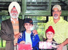 Tanisha Singh and Mansirat Singh Bedi with their golf sets at the Chandigarh Golf Club.